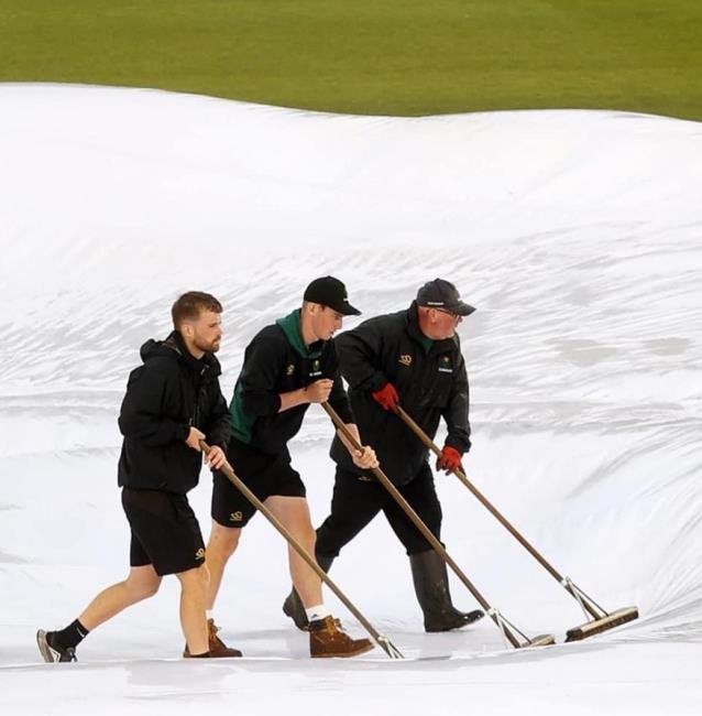Ian and Ben help to try and clear the deluge